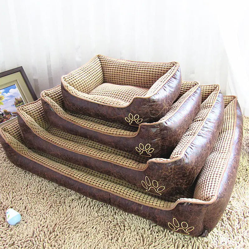 Stacked dog mat pet beds in various sizes with brown leather-look sides and checkered cloth interiors