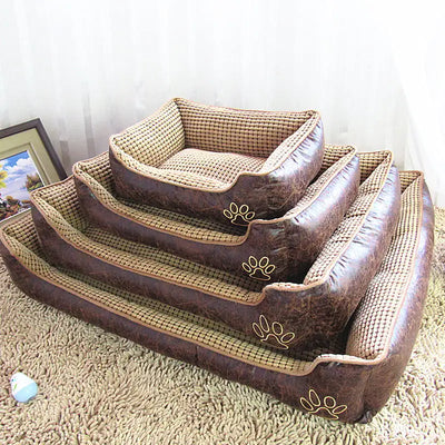Stacked dog mat pet beds in various sizes with brown leather-look sides and checkered cloth interiors