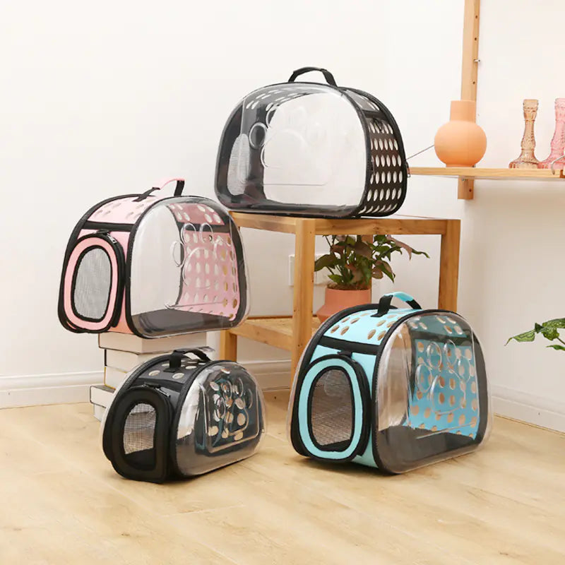 Set of foldable PVC space capsule cat carrier bags in black, blue, pink, and grey colors designed for pet travel and comfort