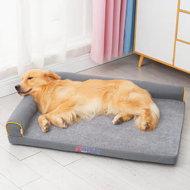 Golden retriever sleeping on removable washable pet nest sofa dog bed in gray color