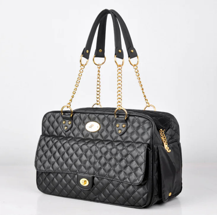 Black checkered pet carrier backpack with gold chain handles for dogs and cats