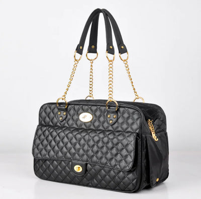 Black checkered pet carrier backpack with gold chain handles for dogs and cats