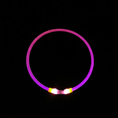 USB rechargeable luminous dog collar glowing pink with bright LED lights against black background