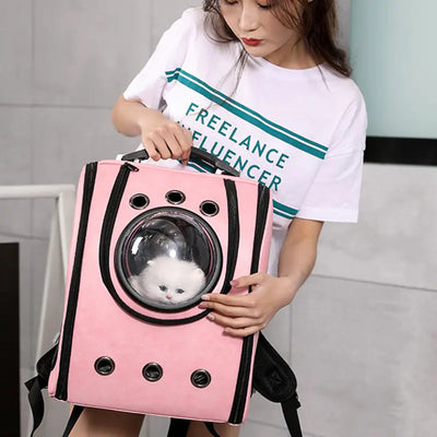 Pink Space Capsule Pet Carrier backpack with transparent acrylic window holding white fluffy cat